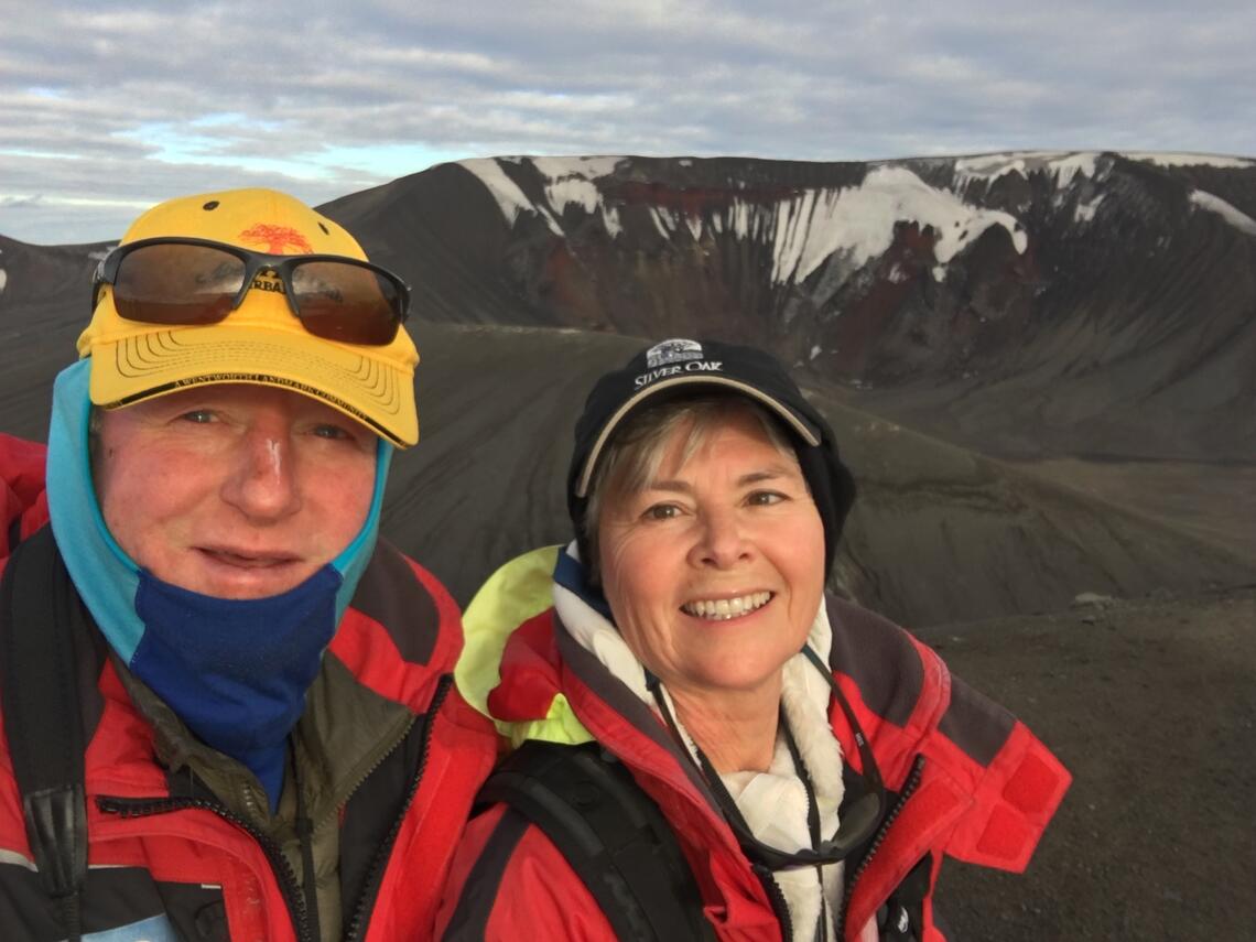 selfie of a man and woman on a mountain